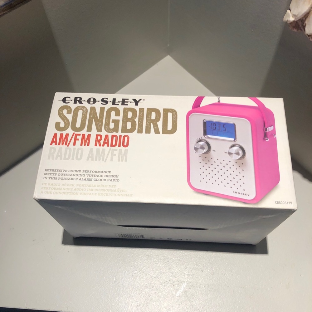 New in box. Crosley songbird radio pink